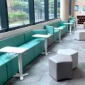 The American Club - Claymore Hill | Product Seen: [Elevate Height Adjustable Table, Seed Modular Stool, Rio Rhombus Arm Sofa (Modular), Rio Parallelogram Arm-less Sofa (Modular) & Rio Trapezium Arm Sofa (Modular)]